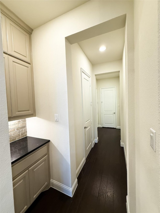 6900 Royal Liverpool Dr, Mckinney, TX 75070 - hallway with baseboards and dark wood finished floors