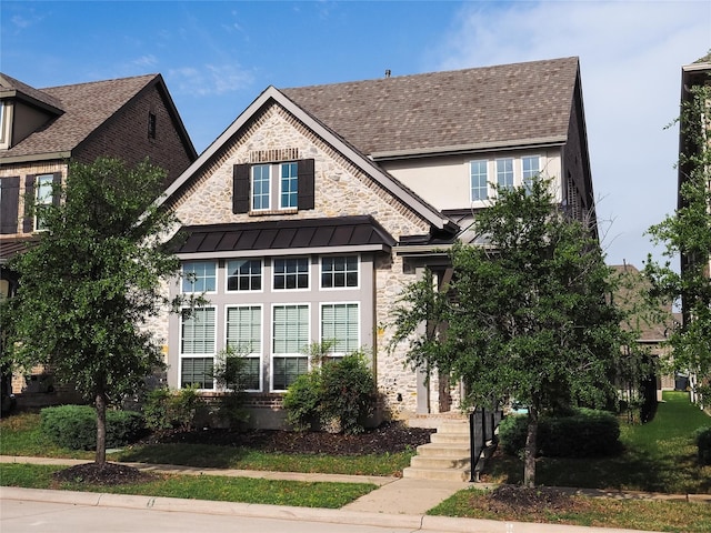 6900 Royal Liverpool Dr, Mckinney, TX 75070 - view of front of property featuring a shingled roof, stucco siding, metal roof, and a standing seam roof