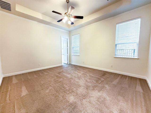 6900 Royal Liverpool Dr, Mckinney, TX 75070 - carpeted empty room with a tray ceiling, visible vents, plenty of natural light, and baseboards