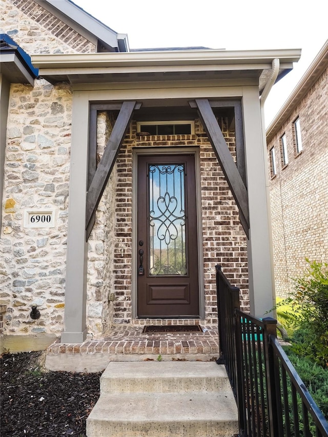 6900 Royal Liverpool Dr, Mckinney, TX 75070 - view of exterior entry featuring brick siding and stone siding