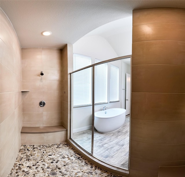 6900 Royal Liverpool Dr, Mckinney, TX 75070 - full bathroom with a soaking tub, recessed lighting, and tiled shower