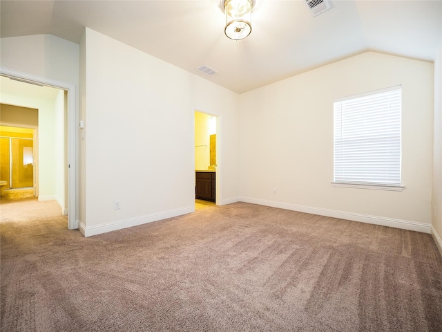 6900 Royal Liverpool Dr, Mckinney, TX 75070 - unfurnished bedroom with visible vents, light carpet, and lofted ceiling