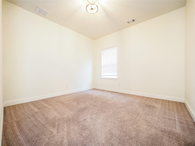 6900 Royal Liverpool Dr, Mckinney, TX 75070 - carpeted spare room featuring visible vents, baseboards, and lofted ceiling