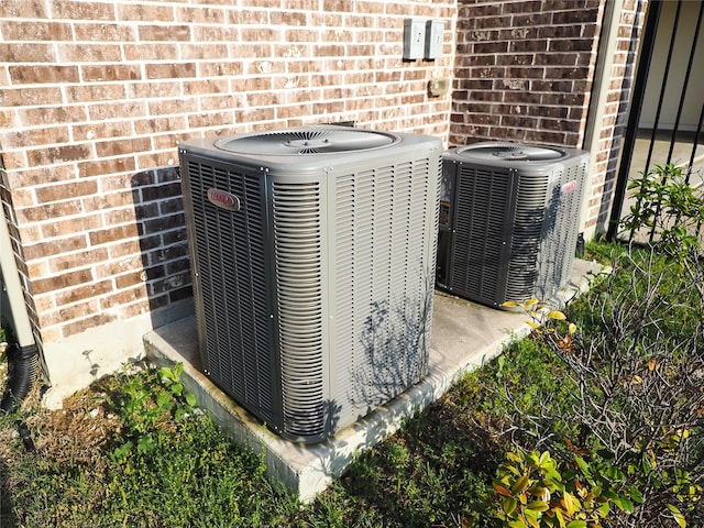 6900 Royal Liverpool Dr, Mckinney, TX 75070 - details featuring brick siding and central AC unit