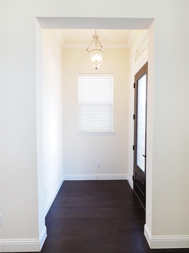 6900 Royal Liverpool Dr, Mckinney, TX 75070 - interior space featuring baseboards, ornamental molding, dark wood finished floors, and a chandelier