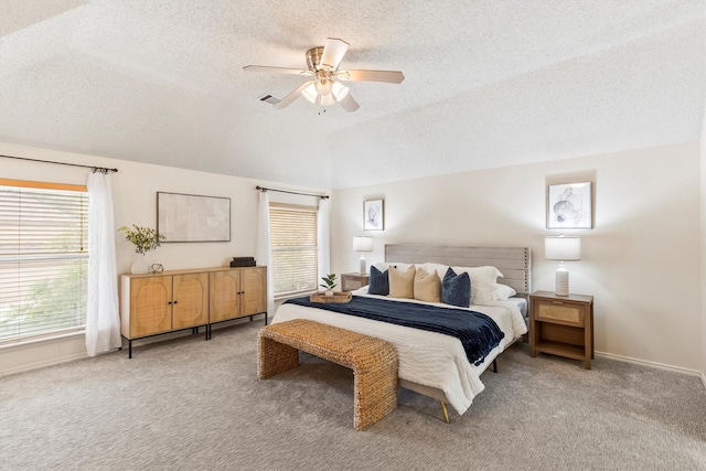 bedroom with carpet floors, a ceiling fan, a textured ceiling, and baseboards