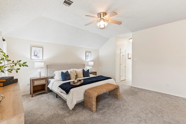bedroom featuring light colored carpet, ceiling fan, visible vents, and lofted ceiling