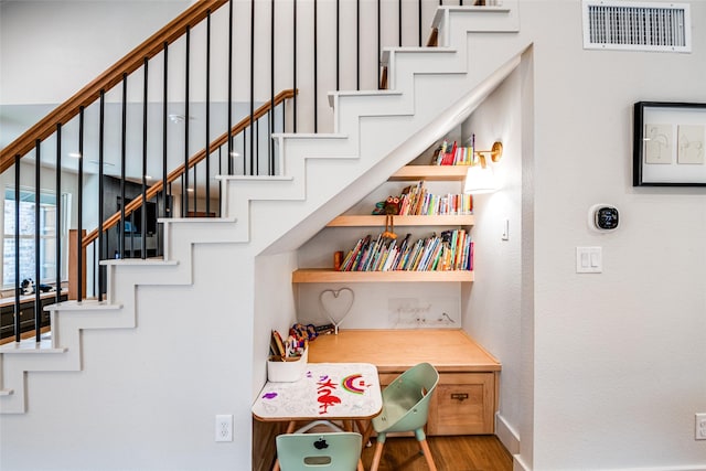 3219 Bryan St, Dallas, TX 75204 - stairs with wood finished floors and baseboards