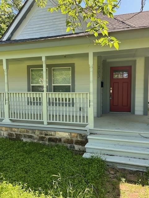 doorway to property featuring covered porch