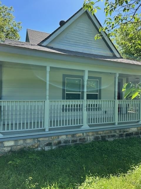 view of property exterior with covered porch