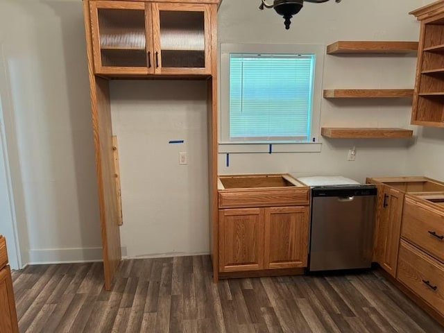kitchen featuring glass insert cabinets, dishwasher, dark wood-type flooring, and brown cabinetry