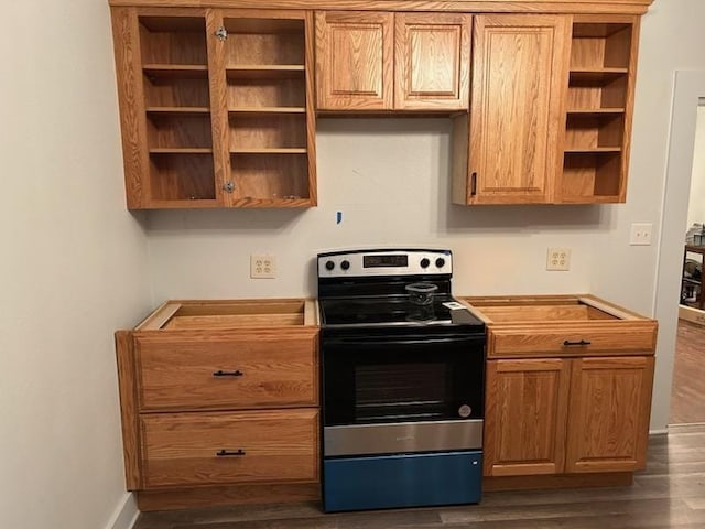 kitchen featuring stainless steel electric range oven, light countertops, dark wood finished floors, and open shelves