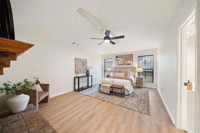 bedroom with ceiling fan, baseboards, visible vents, and light wood-style flooring
