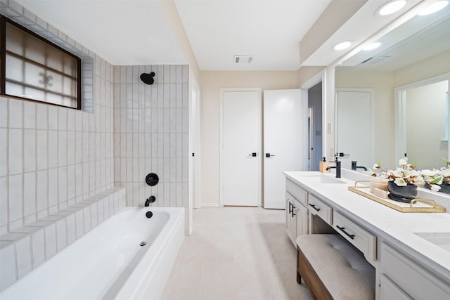 bathroom with a sink, double vanity,  shower combination, and visible vents