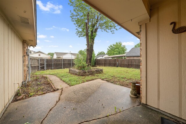 view of yard with a fenced backyard and a patio