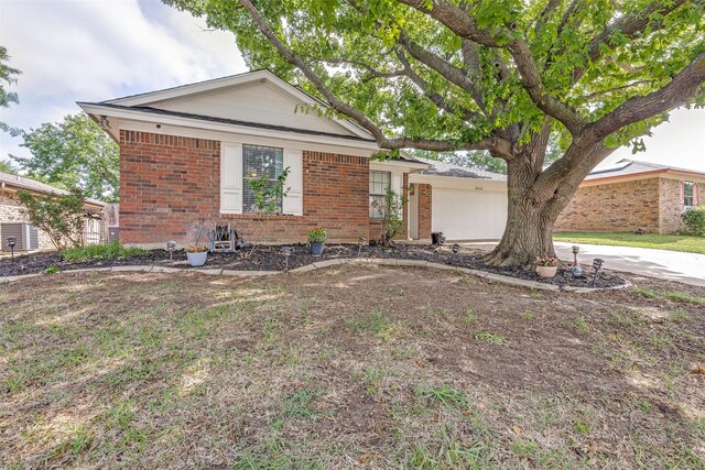 view of front facade with brick siding, a garage, and concrete driveway