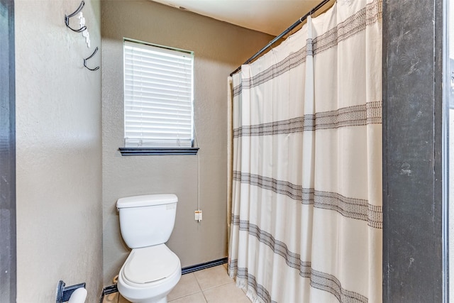 full bathroom with toilet, tile patterned floors, and a shower with curtain