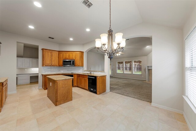 kitchen featuring visible vents, black dishwasher, stainless steel microwave, brown cabinets, and arched walkways