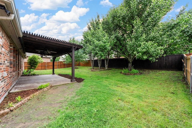 view of yard featuring a patio, ceiling fan, and a fenced backyard