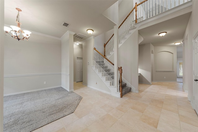 stairs featuring a towering ceiling, crown molding, visible vents, baseboards, and a chandelier