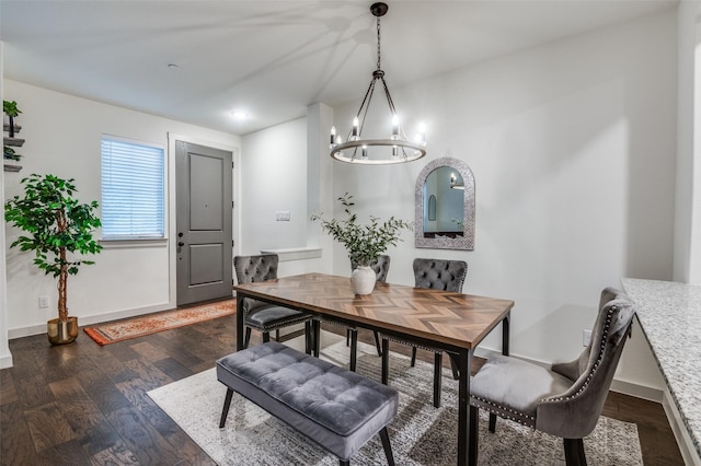 dining space with an inviting chandelier, recessed lighting, baseboards, and dark wood-type flooring