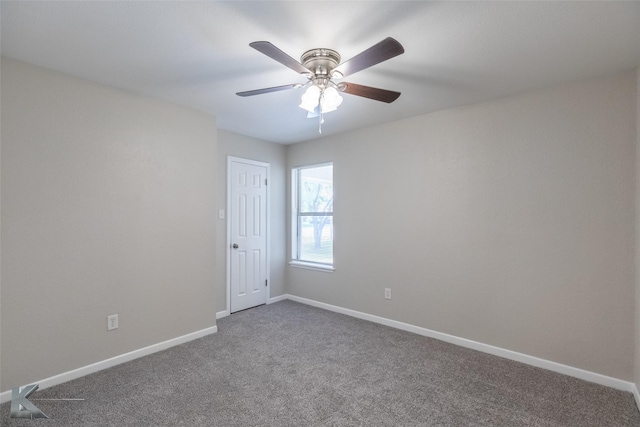 empty room featuring baseboards, carpet, and a ceiling fan