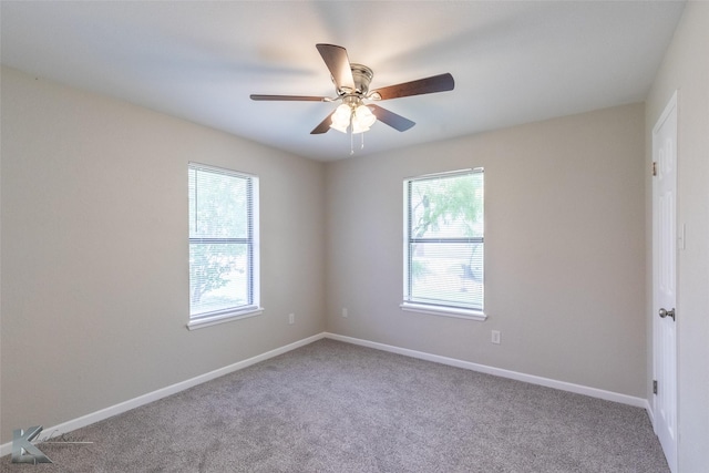 empty room with carpet floors, baseboards, and ceiling fan
