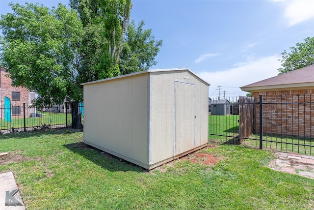 view of shed with fence
