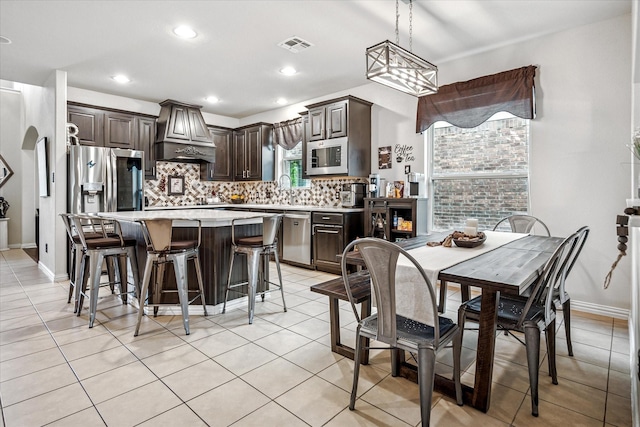 11308 Hubbard Creek Dr, Frisco, TX 75036 - dining area featuring light tile patterned flooring, recessed lighting, and baseboards