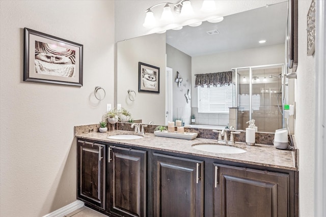 11308 Hubbard Creek Dr, Frisco, TX 75036 - full bathroom featuring double vanity, a garden tub, and a stall shower
