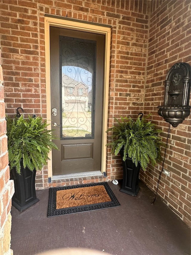 11308 Hubbard Creek Dr, Frisco, TX 75036 - doorway to property featuring brick siding
