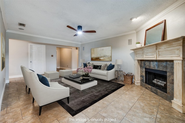 2909 Chisholm Trl, Corinth, TX 76210 - living area featuring a fireplace, ceiling fan, ornamental molding, a textured ceiling, and baseboards