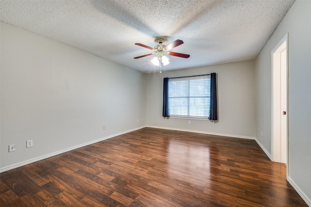 2909 Chisholm Trl, Corinth, TX 76210 - unfurnished room featuring a ceiling fan, dark wood finished floors, a textured ceiling, and baseboards