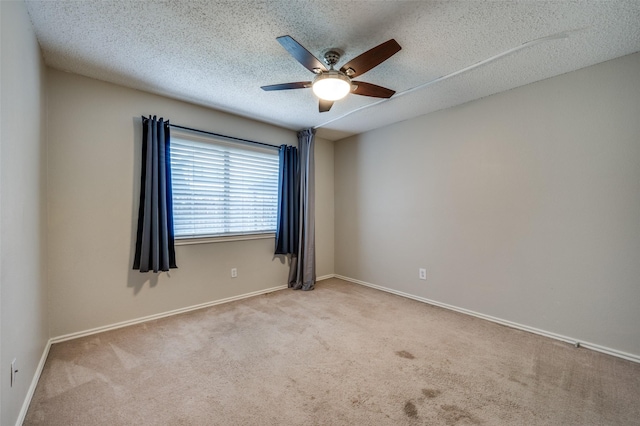 2909 Chisholm Trl, Corinth, TX 76210 - carpeted spare room with ceiling fan, a textured ceiling, and baseboards