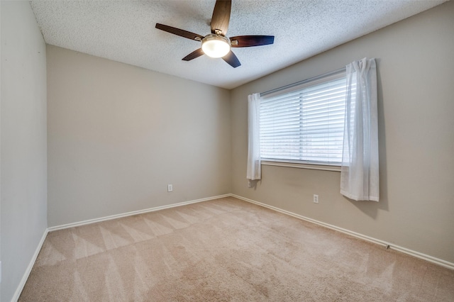 2909 Chisholm Trl, Corinth, TX 76210 - carpeted spare room featuring a ceiling fan, baseboards, and a textured ceiling