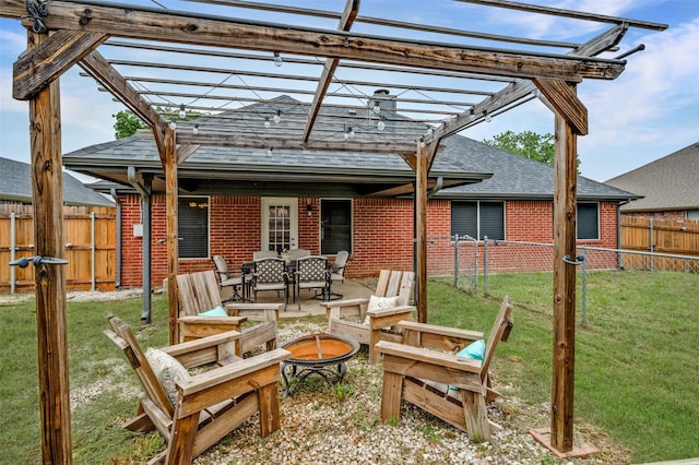 2909 Chisholm Trl, Corinth, TX 76210 - view of patio / terrace with a pergola and a fire pit