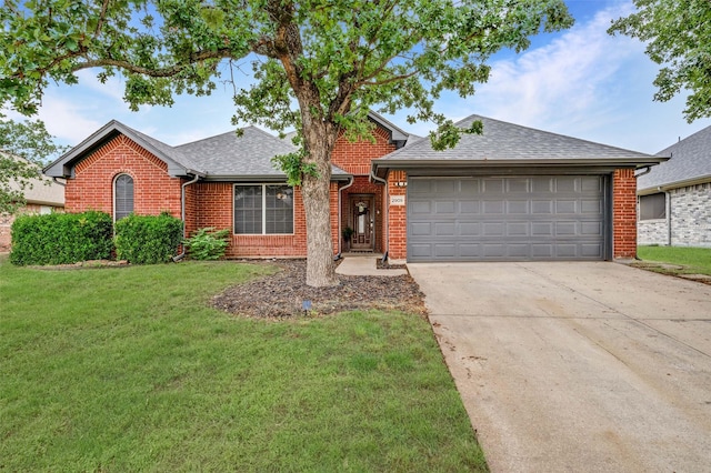 2909 Chisholm Trl, Corinth, TX 76210 - view of front of property featuring brick siding, driveway, a garage, a front lawn, and a shingled roof