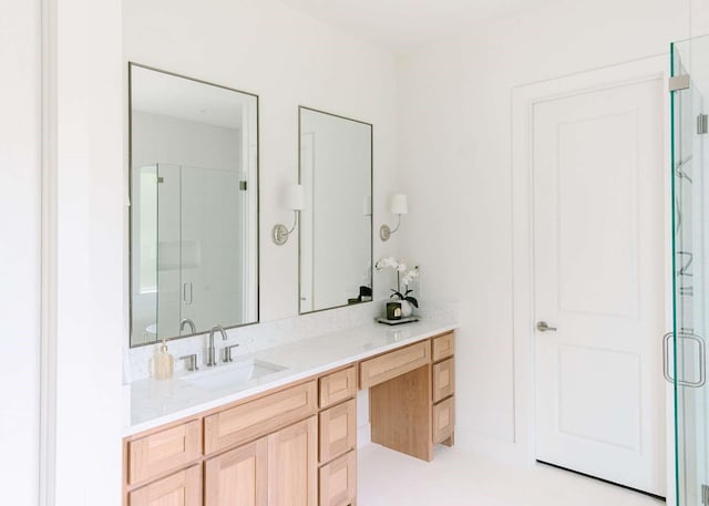 full bathroom featuring vanity and a shower stall