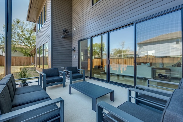 view of patio featuring fence and outdoor lounge area