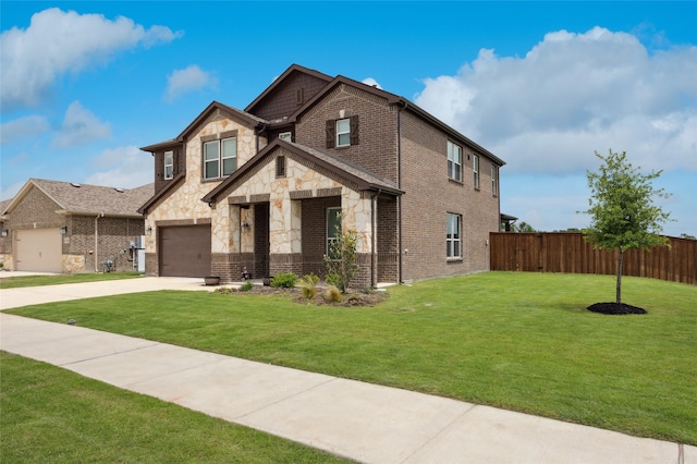 view of front facade with fence, driveway, stone siding, and a front lawn