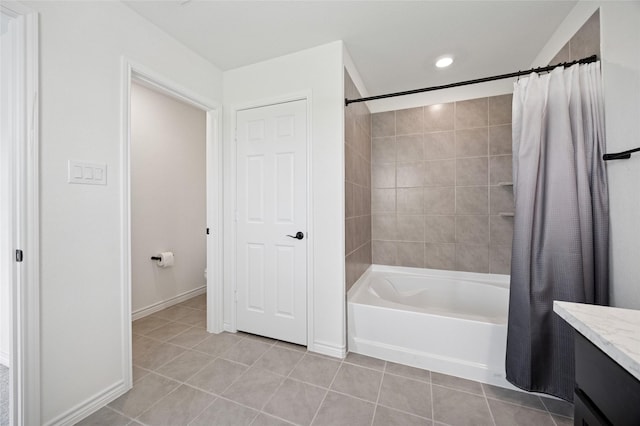 bathroom with tile patterned flooring, vanity, toilet, shower / bathtub combination with curtain, and baseboards