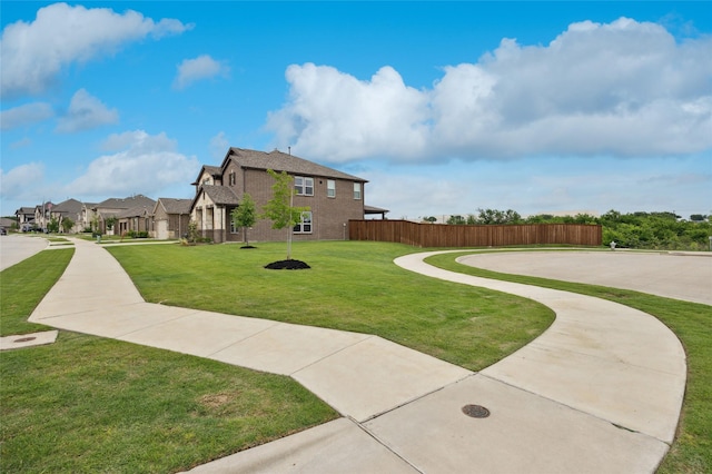 exterior space with fence and a residential view