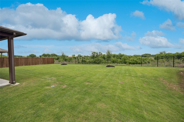 view of yard with fence