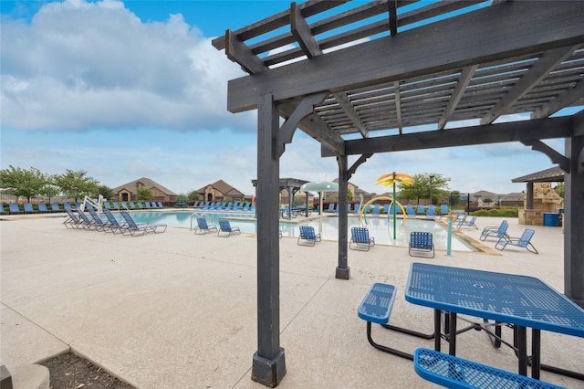 community pool featuring a pergola and a patio