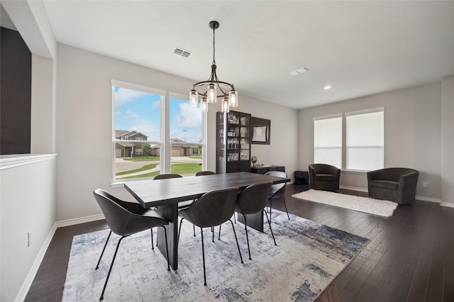 dining room with visible vents, baseboards, an inviting chandelier, recessed lighting, and hardwood / wood-style floors