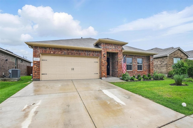 8557 Big Apple Dr, Fort Worth, TX 76179 - view of front facade featuring a front lawn, concrete driveway, central AC unit, and brick siding
