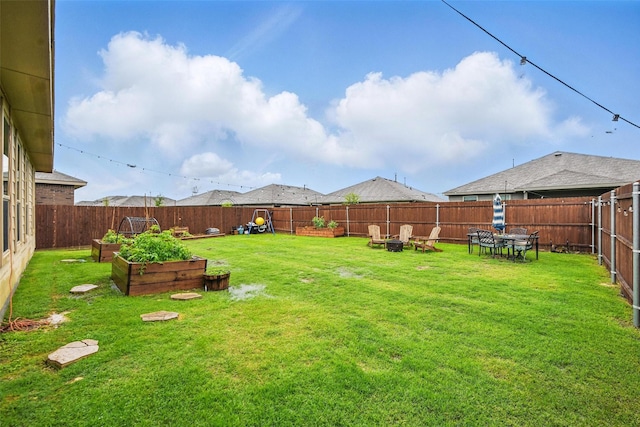 8557 Big Apple Dr, Fort Worth, TX 76179 - view of yard featuring a garden and a fenced backyard