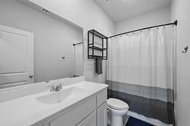 8557 Big Apple Dr, Fort Worth, TX 76179 - bathroom featuring curtained shower, vanity, toilet, and visible vents