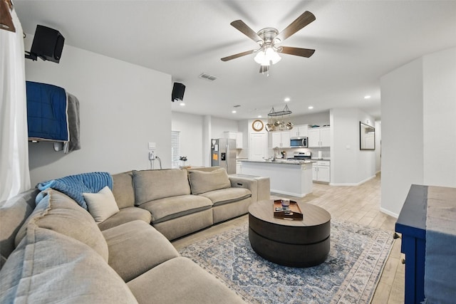 8557 Big Apple Dr, Fort Worth, TX 76179 - living area with light wood-type flooring, visible vents, recessed lighting, a ceiling fan, and baseboards
