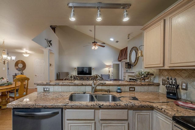415 Oak Leaf Dr, Duncanville, TX 75137 - kitchen with decorative backsplash, ceiling fan, a sink, a peninsula, and stainless steel appliances